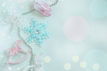 Layout, flat lay in pastel colors, New Year's crystal toys, bokeh.