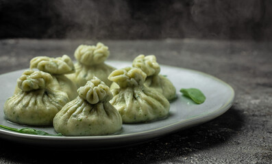 Hot Khinkali with cheese and spinach. Restaurant menu, dieting, cookbook recipe top view