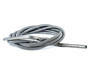 Metal cable for cleaning sewer pipes isolated on white background