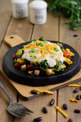 Mexican salad, red beans, chickpeas, coriander, colored peppers, cumin, green onions, delicious sauce, chips.