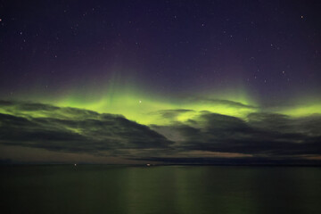 Fototapeta na wymiar Aurora Borealis or northern lights on the west coast of Greenland, Denmark 