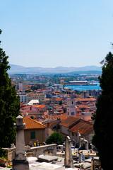 view of the old town Sibenik, Croatia with a graveyard in the foreground 