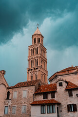 church tower (steeple) in the middle of an old town with dramatic weather/clouds in Split, Croatia