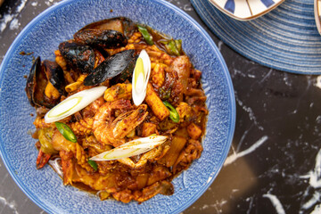 Korean traditional food various seafood stir-fried with spicy sauce