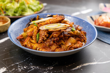 Korean traditional food various seafood stir-fried with spicy sauce