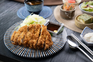 Pork cutlet and various Asian-style side dishes