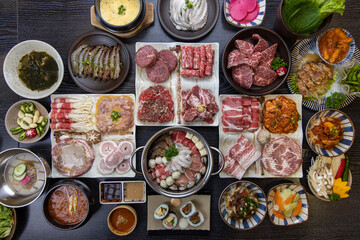 Korean traditional style assorted bbq grilled set, fresh Asian side dish vegetables, and shabu-shabu