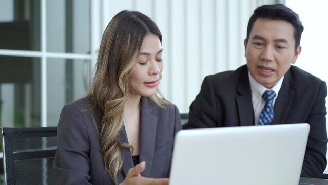 Senior general manager making a discussion or talking to his female secretary.