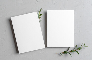 Invitation card mockup with eucalyptus twigs, front and back sides