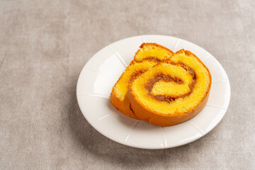 pineapple roll cake (Indonesia bolu gulung nenas) Bolu Gulung is a sponge cake that is baked using a shallow pan, filled with jam or butter cream and then rolled.