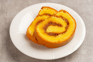 pineapple roll cake (Indonesia bolu gulung nenas) Bolu Gulung is a sponge cake that is baked using a shallow pan, filled with jam or butter cream and then rolled.