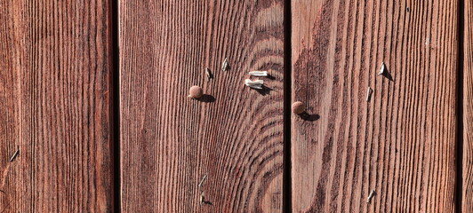 an empty bulletin board made of old wooden boards 