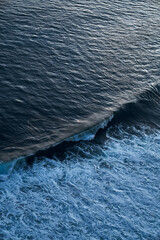Aerial view of a big wave breaking