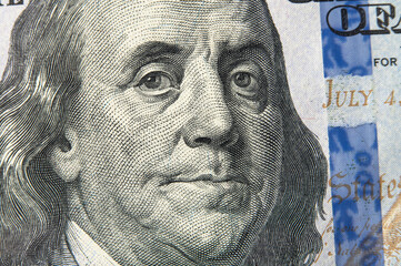 Benjamin Franklin's face on the US 100 dollar bill. Franklin on one hundred dollar bill. Detail of...