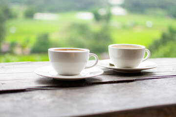 Coffee Cup on Table Against Landscape Scenery Mountain Hill Background