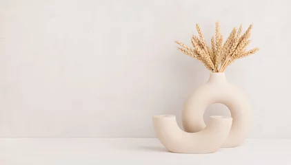 Fotobehang Wheat ears in a stylish modern vase, Scandinavian interior decoration concept, banner, copy space © CHZU