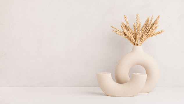 Wheat ears in a stylish modern vase, Scandinavian interior decoration concept, banner, copy space