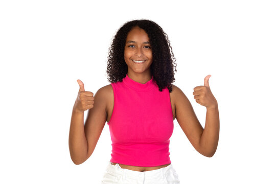 Young girl wearing pink t-shirt over white background doing happy thumbs up gesture with hand.