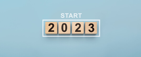 2023 New Year Start. New year 2023 with wood cube in progress bar. creative background for new year. Start new year 2023 concept. goal , action plan, strategy, new year business vision.