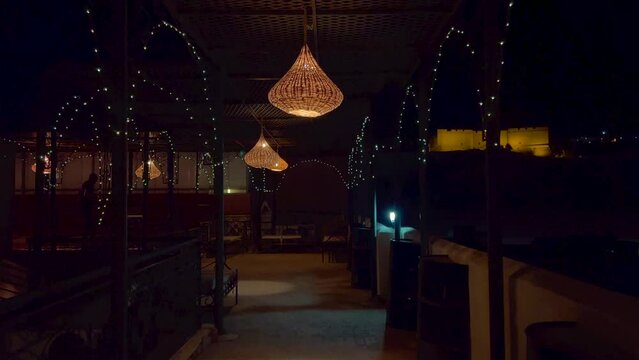 Row of Wicker lamps hanging in the terrace of a riad in Fes