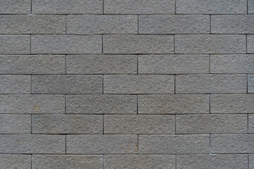 Cement floor, dark gray square shape, rough surface, placed alternately, forming a beautiful wall.