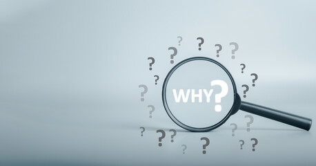 Magnifying focuses on "WHY ?"question text and question mark be around. Business answer and analysis, problem ask, interrogation, research information concept. with copy space on grey background.