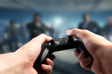 Gamepad, joystick GAM22ICB in the hands of a gamer against the background of a video game on a TV screen, a personal computer monitor. Adventure online games, virtual reality.