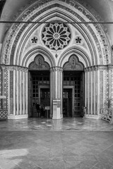 Fototapeta premium Ancient Papal basilica of San Francesco of Assisi. Art and religion. Black and white