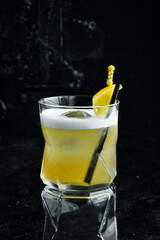 Cocktail. Alcoholic cocktail with lemon liqueur and lemon peel in a glass. Bar menu.