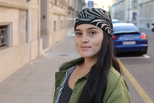 Young ethnic urban woman wearing a bandana 