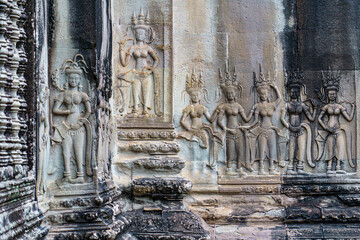 Cambodia. Siem Reap Province. A Devata sculpture in bas relief at Angkor Wat (Temple City). A Buddhist and temple complex in Cambodia and the largest religious monument in the world