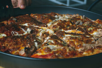Tasty homemade tuna pizza. Closeup view of Homemade traditional pizza