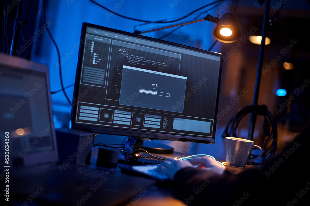 Poster cybercrime, hacking and technology concept - close up of male hacker in dark room writing code or us