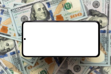 transparent smartphone screen  on US dollar banknotes background