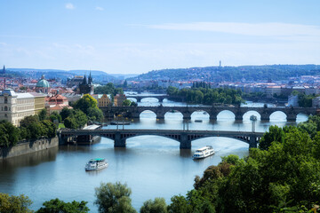 Fototapeta na wymiar View of the bridges on the Vlatva River in the Czech city of Prague from the Summer Gardens.