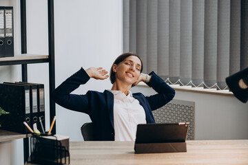 Business woman working on tablet at the office