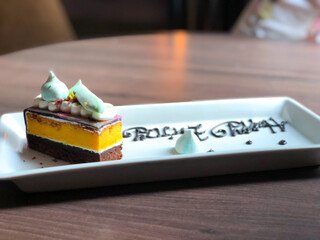 Close Up Rainbow Colorful Sweet Cake on Wooden Table