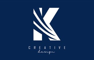 White letter k logo with leading lines and negative space design. Letter with geometric and creative cuts concept.