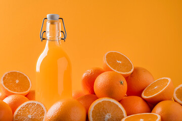 Fresh orange juice surrounded by oranges. Summer colors. 