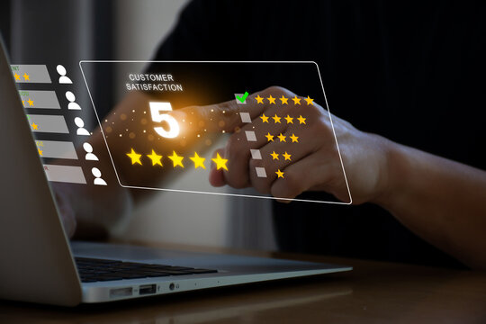 Customer review satisfaction feedback survey concept, User give rating to service experience on laptop. Customer can evaluate quality of service leading to reputation ranking of business.