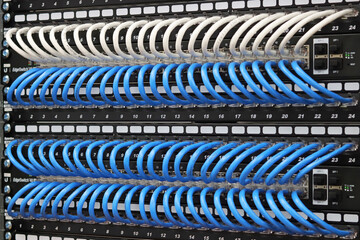 Connecting an Ethernet switch using patch cords with RJ45 connectors for data transmission in the data center.