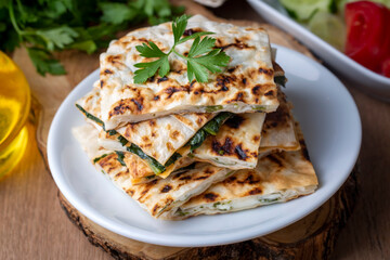 Traditional Turkish food, Turkish pancake gozleme with cheese and herb. The appetizer is Turkish...