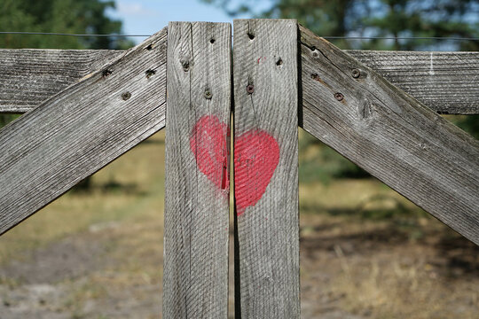 Gate of Love, Heart on a wooden gate in the forest