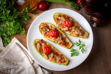 Zucchini stuffed with meat, vegetables and cheese. Zucchini boats. Turkish name; kabak sandal
