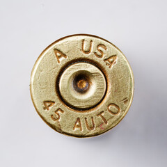 Pistol bullet casings on white background, top view
