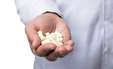 multivitamins pills closeup. multivitamins and medications. hands hold multivitamins