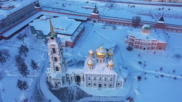 Scenic view from drone of snow covered Tula Kremlin and Holy Assumption Cathedral on background with cityscape, Russia