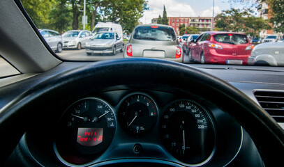 A traffic jam in the city.
View from inside a car of a traffic jam on a city road at rush hour