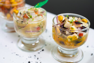 hot and cold entrees such as ceviche, octopus, asparagus, medallions, and tarts
