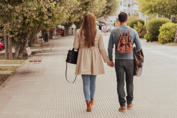 couple walking in autumn in the city or on a trip
